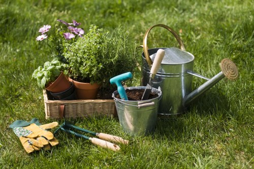 Gardener wearing PPE and operating lawn equipment